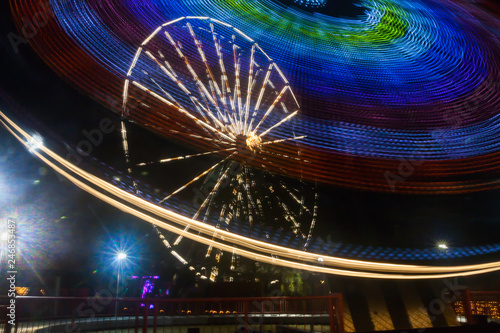 Ferris wheel in motion at the amusement park, night illumination. Long exposure © Elena Noeva