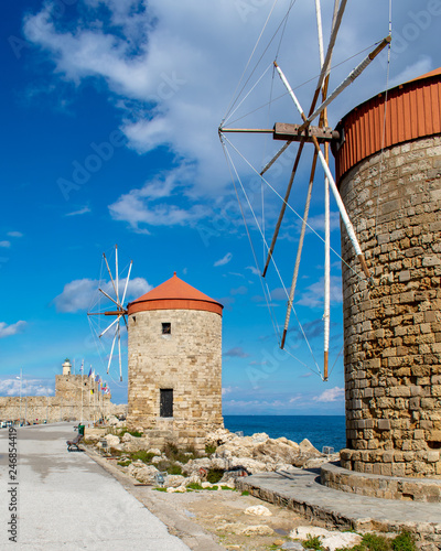 rhodes,greece old windmills in the port by the sea of aegean