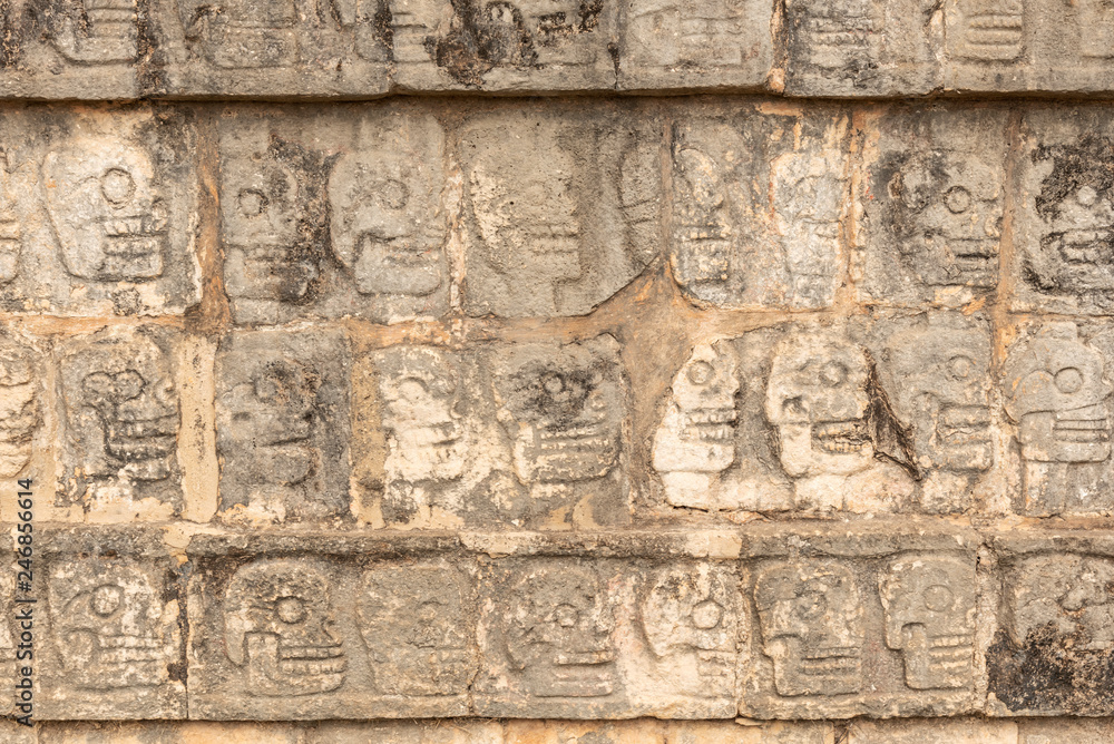 Row of skulls from the sacrificed people in Chichen Itza. Engraving of all the people whose heart was been offered to deities in Mexico
