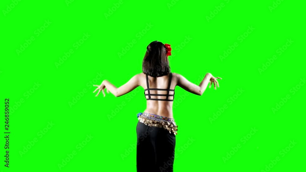 Beautiful woman dancing zumba while wearing sportswear in the studio. Shot in 4k resolution with green screen background Beautiful woman dancing zumba while wearing sportswear in the studio. Shot in 4k resolution with green screen background