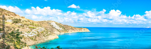 Beautiful Panorama with turquoise sea. View of Theseus Beach, Ammoudi, Crete, Greece. HD landscape, blue sky and mountains.