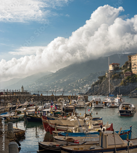 Picturesque sky clouds with port of Camogli