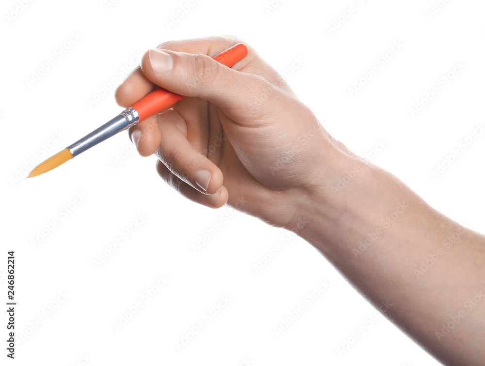Man holding paint brush on white background, closeup Man holding paint brush on white background, closeup
