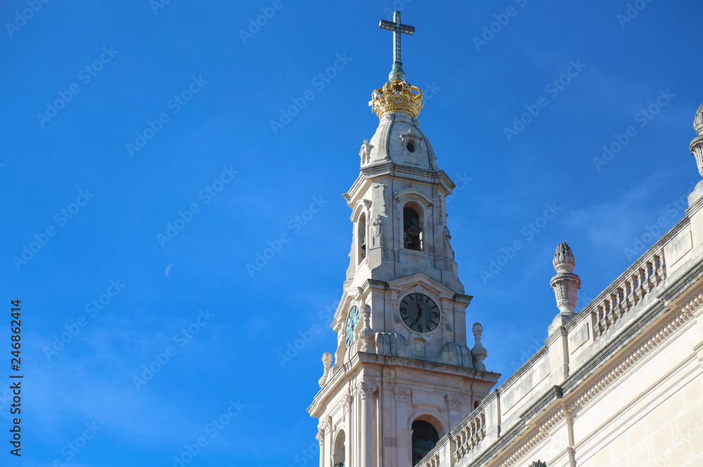 Detail of the belltower of the basilica of fatima with a clear sky in summer