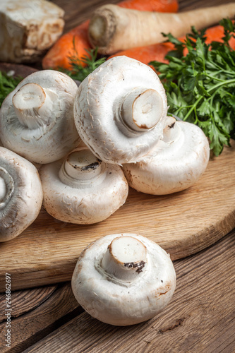 Fresh mushrooms on cutting board.