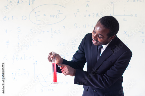 African teacher teaching science in the stem class.