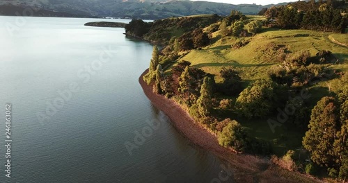 High above Takamatua Bay, New Zealand during golden hour photo