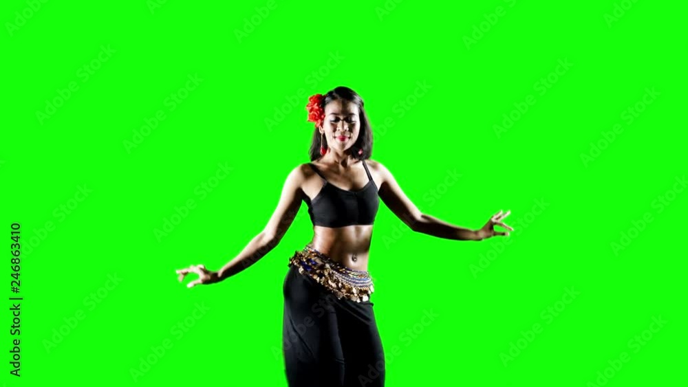 Pretty young woman dancing zumba in the studio. Shot in 4k resolution with green screen background Pretty young woman dancing zumba in the studio. Shot in 4k resolution with green screen background