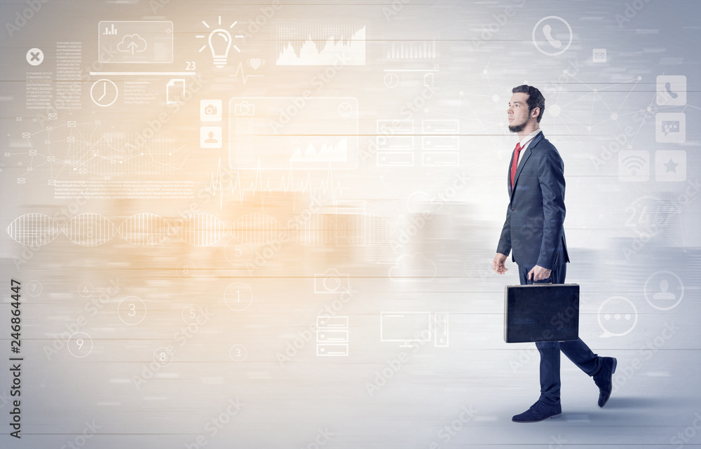 Handsome businessman walking in suit with briefcase on his hand and database concept around
Handsome businessman walking in suit with briefcase on his hand and database concept around