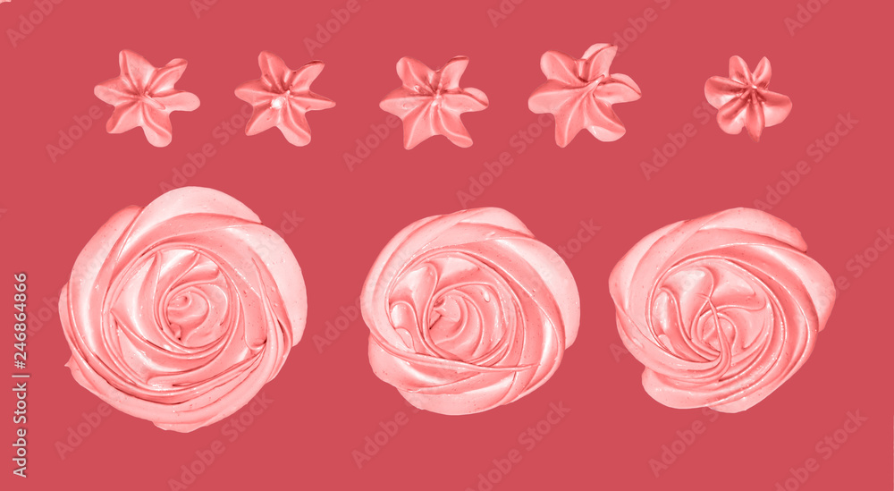 pink marshmallow in the form of a flower for the decoration of a festive dessert on an isolated Coral background pink marshmallow in the form of a flower for the decoration of a festive dessert on an isolated Coral background