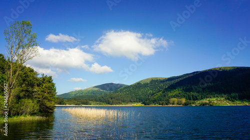 View of Abant Lake (Abant Golu). Landscape of an mountain lake in front of mountain range. Glorious lake landscape. The collaboration of blue and green. Multiple colors and amazing lake scenery. 