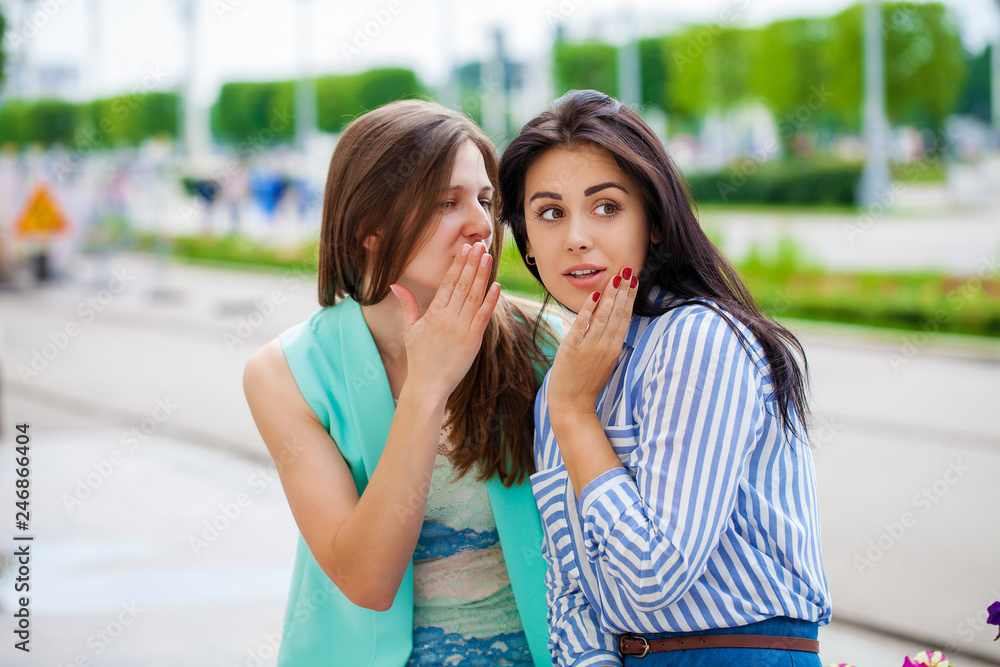 Two young women talking to each other Two young women talking to each other