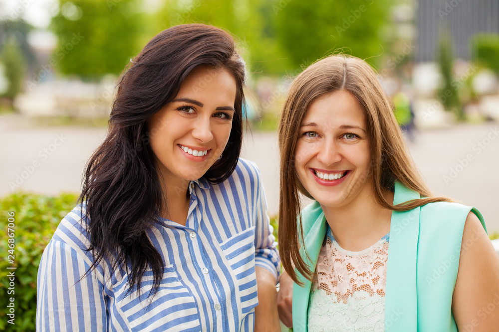 Closeup portrait of a happy young women smiling