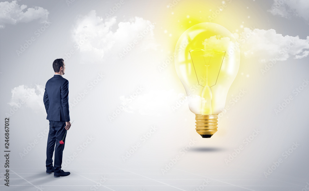 Fototapeta premium Businessman standing with his back with objects in his hand and looking at the globe, courtesy of NASA 