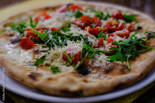 pizza with rocket, parmesan and cherry tomatoes