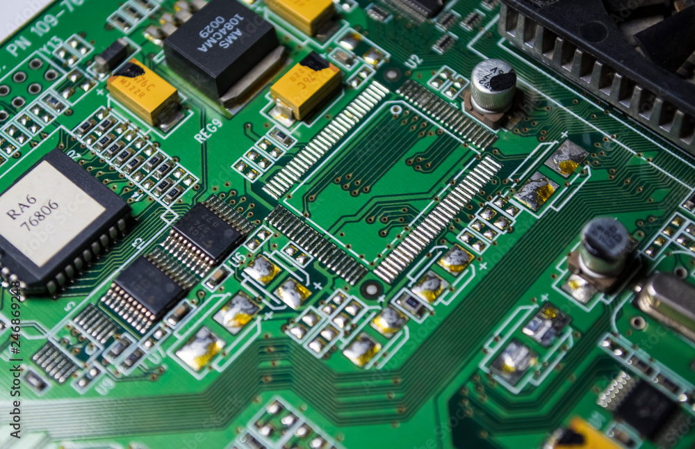 The green motherboard from the personal computer. Modern electronics and details. Correction of malfunctions. Texture, background. The green motherboard from the personal computer. Modern electronics and details. Correction of malfunctions. Texture, background.