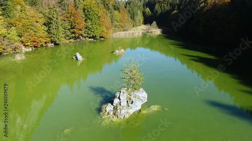 AERIAL - Lake Berglsteiner, a beautiful lake with green color in the TIroler Alps with the DJI Phantom 4. photo