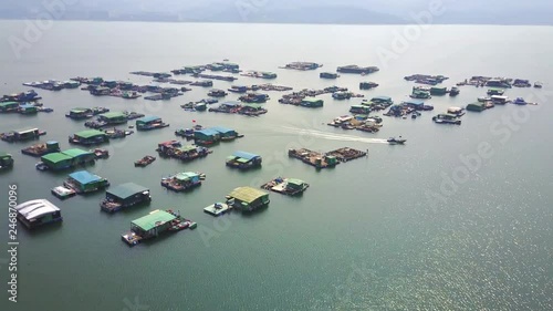 Shuen Wan Typhoon Shelter, Tai Po, Hong Kong.
Boat moving from mariculture raft to the sea photo