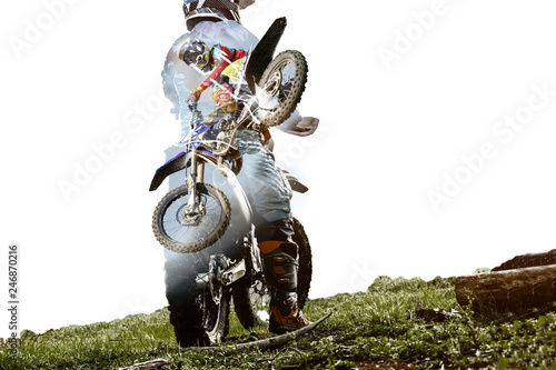 Foto Double exposure with Man riding a motorcycle with racer jumps and takes off on s