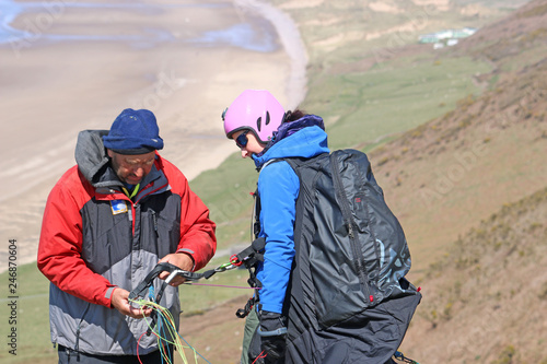 Paraglider preparing to launch at Rhossili