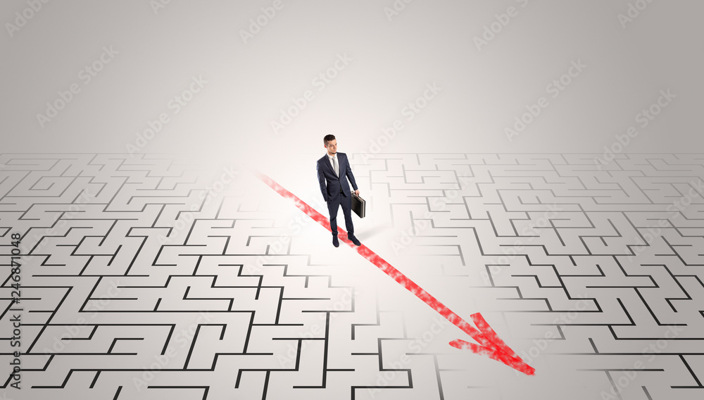 Businessman going through the maze with red arrow
Businessman going through the maze with red arrow