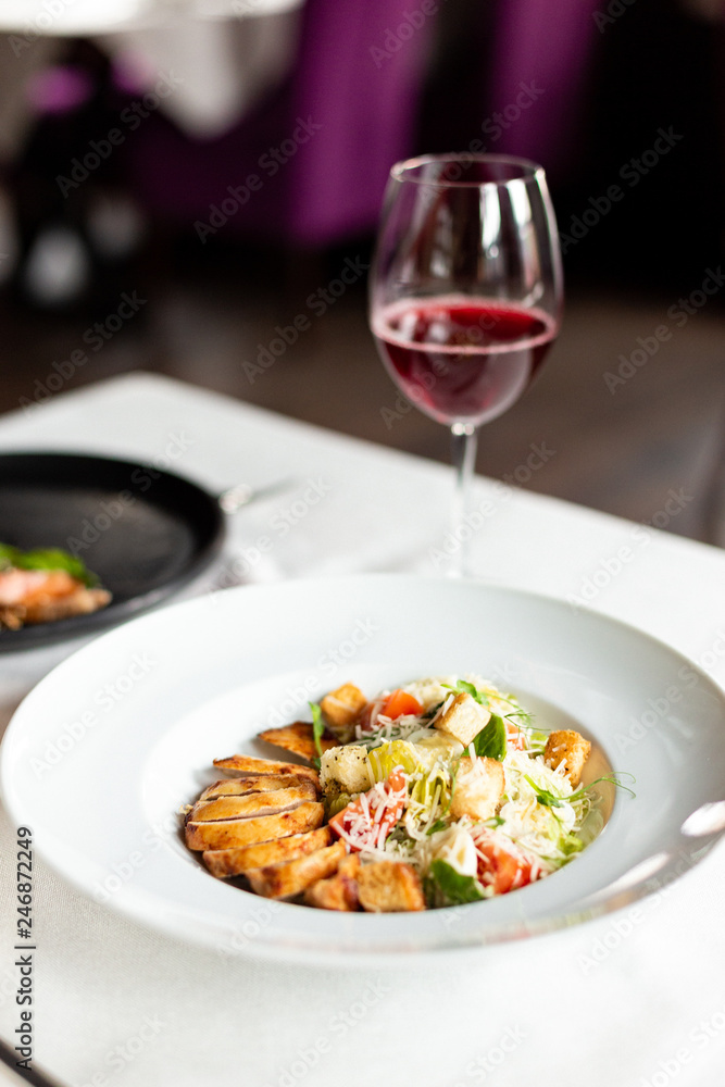 Romain salad with grilled chicken, garlic croutons and parmesan