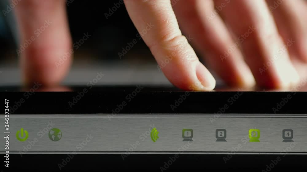 A man disconnects the cables from the WAN port and LAN ports