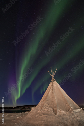 Northern lights over a traditional sami tipi in Northern Norway.  photo