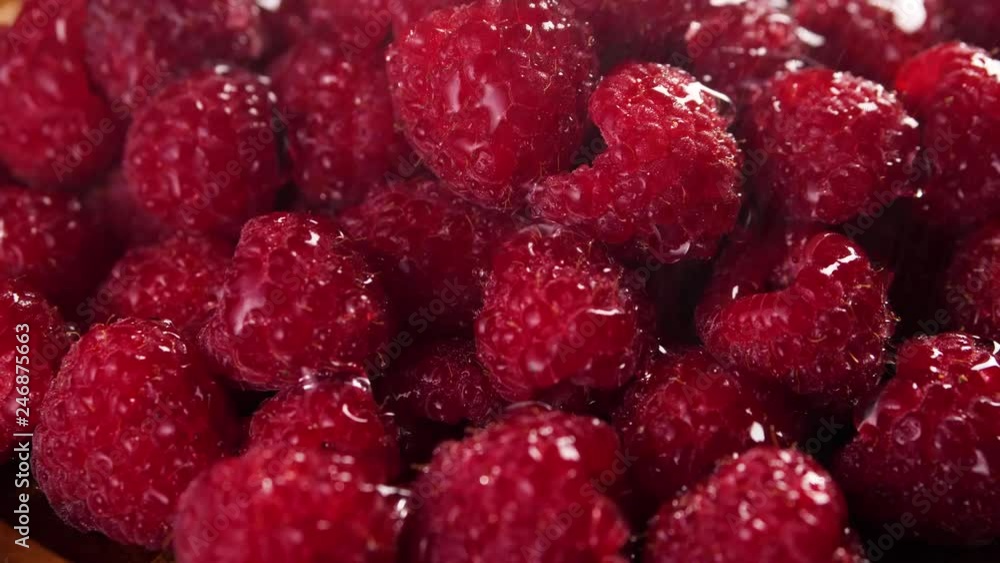 Heap of fresh raspberries under rain. Closeup macro shot. Fresh berry series. 4k. Heap of fresh raspberries under rain. Closeup macro shot. Fresh berry series. 4k.