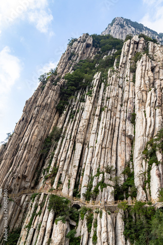 Trail and cliffs in Songshan Mountain, Dengfeng, China. Songshan is the tallest of the 5 sacred mountains of China dedicated to Taoism and stand above the famous Shaolin temple in Henan Province