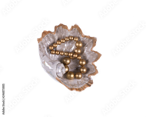decorative seashell with pearls on a white isolated background