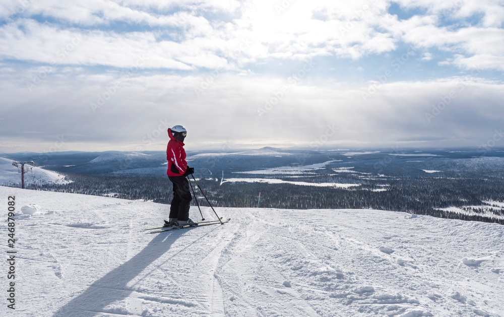 Woman downhill skiing in Lapland Finland