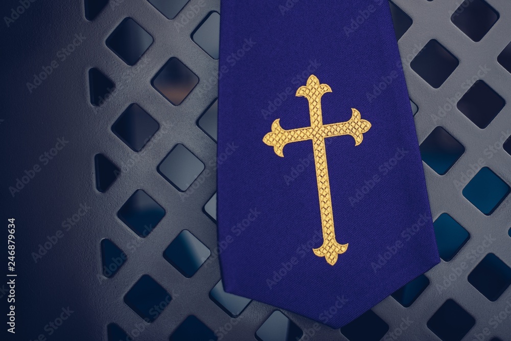 Purple fabric stole in confessional in church.