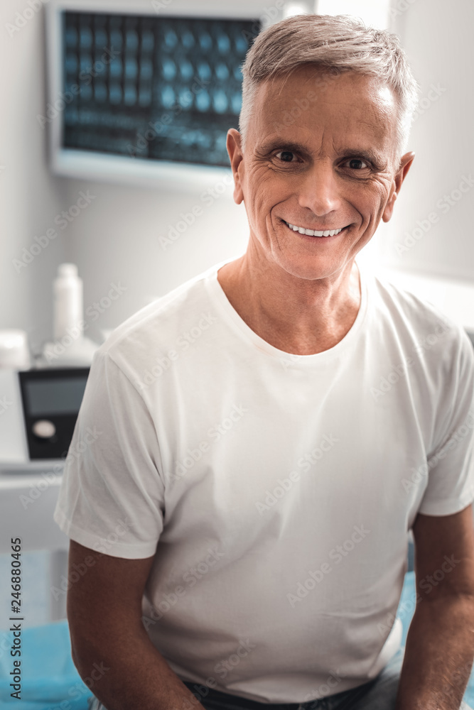 Grey-haired beaming man feeling happy Grey-haired beaming man feeling happy