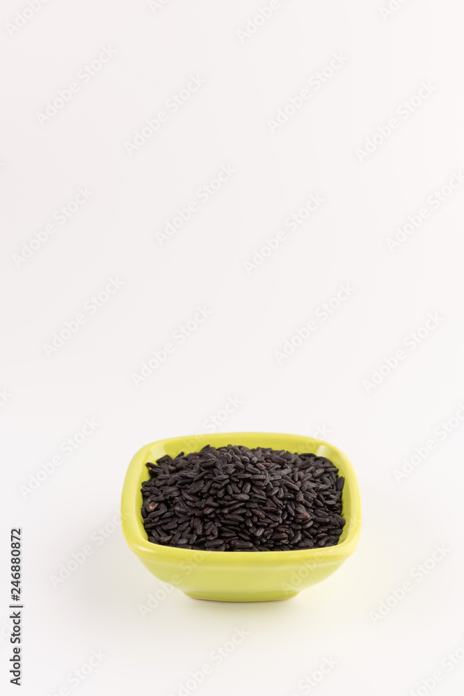 bowl of black wild rice isolated on white background bowl of black wild rice isolated on white background