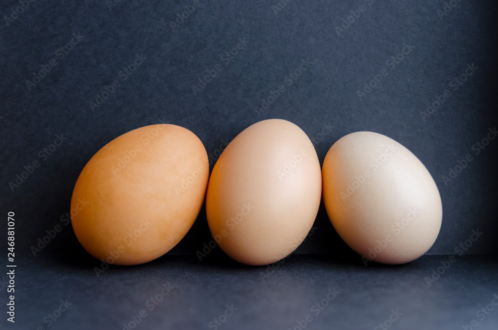 Three eggs on the black background Three eggs on the black background