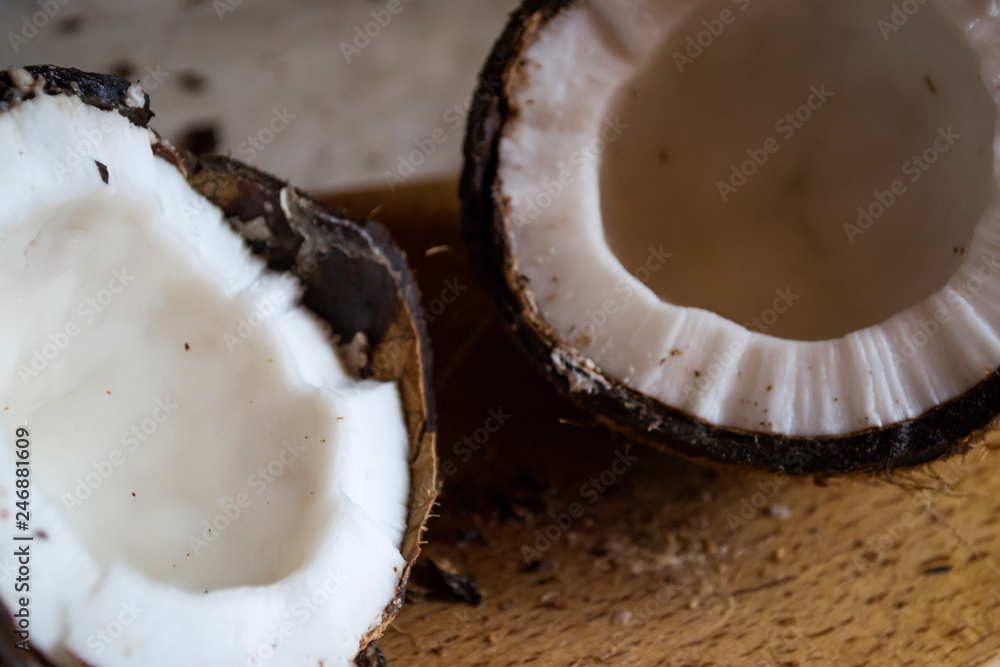 Coconut on a white wooden background. Coconut on a white wooden background.