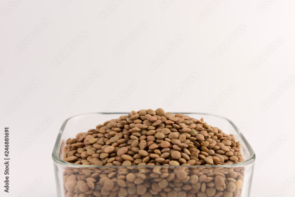 Yellow lentil in a bowl isolated on white background Yellow lentil in a bowl isolated on white background