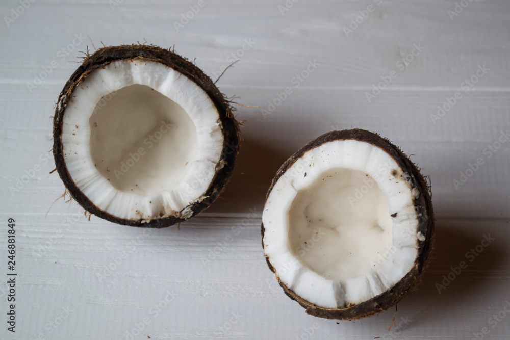 Coconut on a white wooden background. Coconut on a white wooden background.
