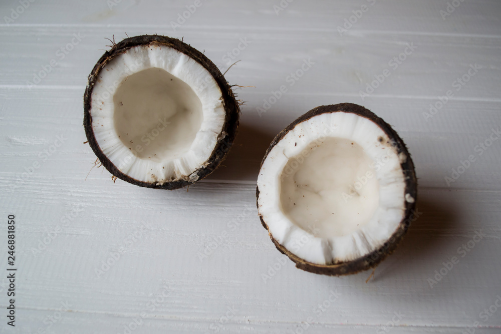 Coconut on a white wooden background. Coconut on a white wooden background.