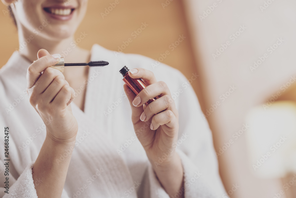 Young beautiful woman holding mascara Young beautiful woman holding mascara