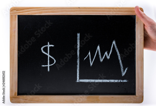 Hand holding American dollars value diagram on a blackboard on white background © EnesBerkay