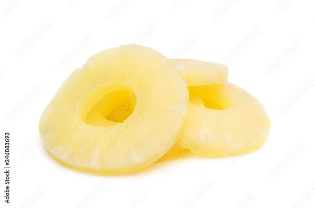 Heap of canned pineapple rings on white.