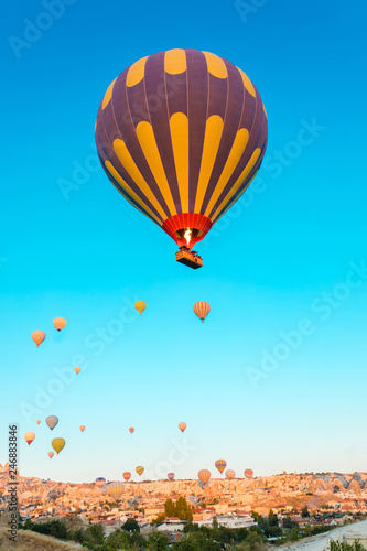 Colorful hot air balloons flying over at fairy chimneys in Nevsehir, Goreme, Cappadocia Turkey. Hot air balloon flight at spectacular Cappadocia Turkey. 