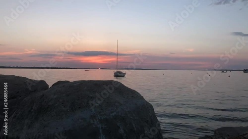 Timelapse of sunset in croatia with boat