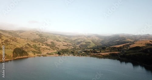 High above Takamatua Bay, New Zealand during golden hour photo