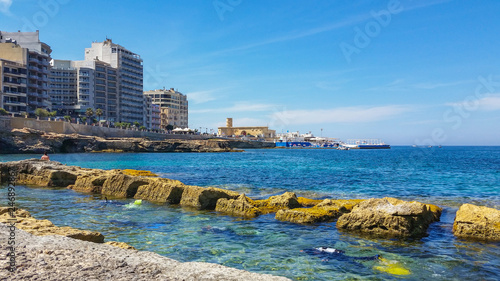 Divers swimming to shore in Sliema, Malta © Ildiko
