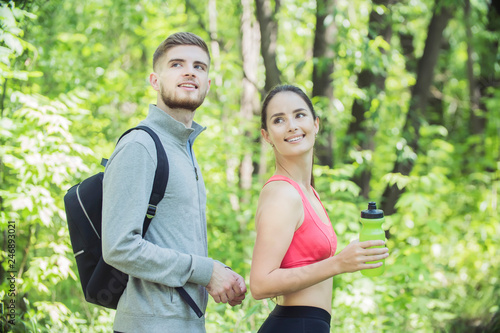 young couple of runners at Forest Environments, wandering in forests