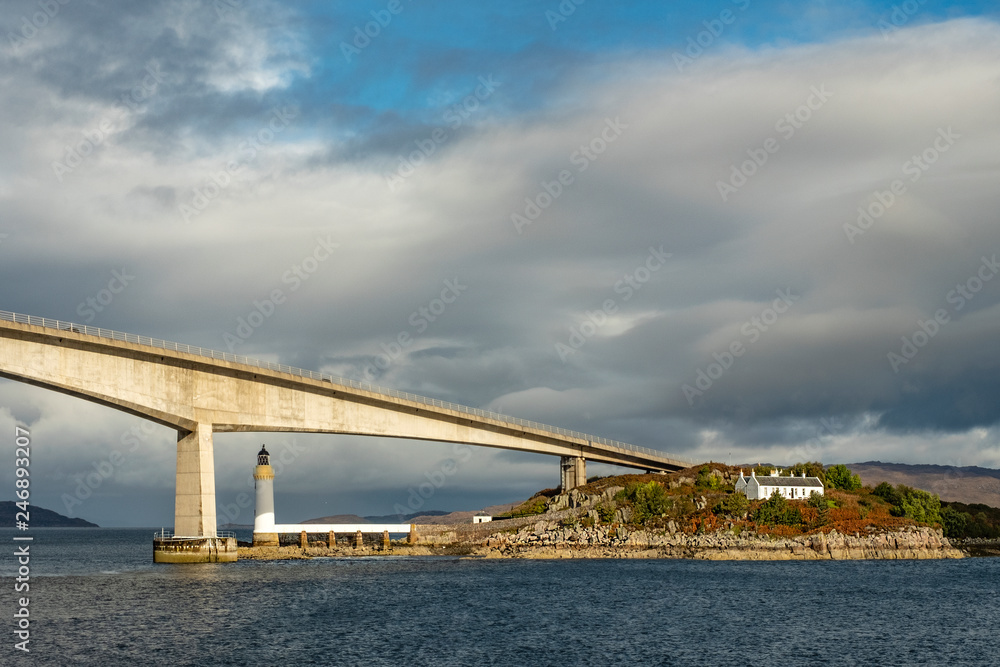 Lighthouse under the tall bridge, Scotland, UK Lighthouse under the tall bridge, Scotland, UK
