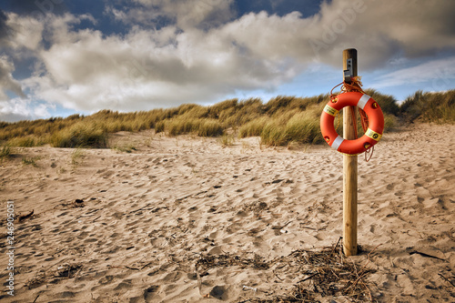 Life saver on post at beach